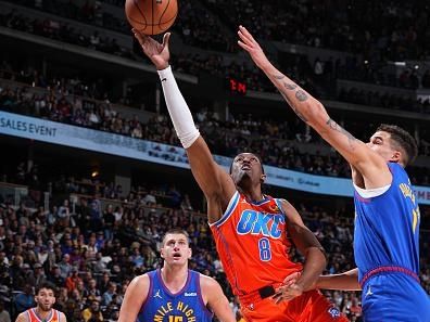 DENVER, CO - DECEMBER 16: Jalen Williams #8 of the Oklahoma City Thunder drives to the basket during the game against the Denver Nuggets on December 16, 2023 at the Ball Arena in Denver, Colorado. NOTE TO USER: User expressly acknowledges and agrees that, by downloading and/or using this Photograph, user is consenting to the terms and conditions of the Getty Images License Agreement. Mandatory Copyright Notice: Copyright 2023 NBAE (Photo by Garrett Ellwood/NBAE via Getty Images)