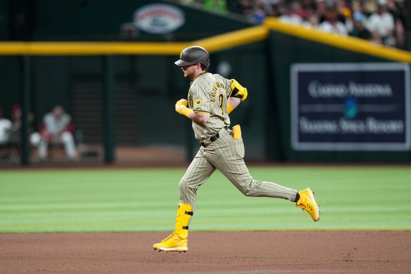 May 3, 2024; Phoenix, Arizona, USA; San Diego Padres first base Jake Cronenworth (9) runs the bases after hitting a home run against the Arizona Diamondbacks during the fourth inning at Chase Field. Mandatory Credit: Joe Camporeale-USA TODAY Sports