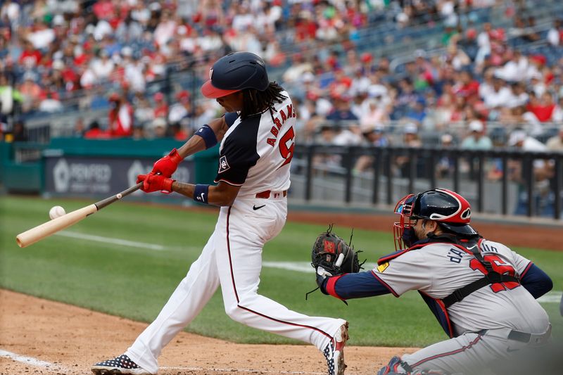 Jun 9, 2024; Washington, District of Columbia, USA; Washington Nationals shortstop CJ Abrams (5) hits a three run double against the Atlanta Braves during the fourth inning at Nationals Park. Mandatory Credit: Geoff Burke-USA TODAY Sports