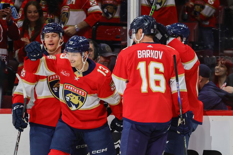 Apr 21, 2024; Sunrise, Florida, USA; Florida Panthers center Sam Reinhart (13) celebrates with teammates after scoring against the Tampa Bay Lightning during the first period in game one of the first round of the 2024 Stanley Cup Playoffs at Amerant Bank Arena. Mandatory Credit: Sam Navarro-USA TODAY Sports