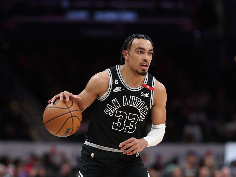 WASHINGTON, DC - MARCH 24: Tre Jones #33 of the San Antonio Spurs dribbles against the Washington Wizards during the first half at Capital One Arena on March 24, 2023 in Washington, DC. NOTE TO USER: User expressly acknowledges and agrees that, by downloading and or using this photograph, User is consenting to the terms and conditions of the Getty Images License Agreement.  (Photo by Patrick Smith/Getty Images)