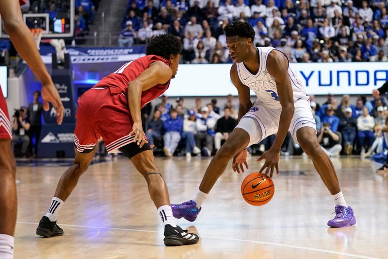 Mar 7, 2026; Provo, Utah, USA; BYU Cougars forward AJ Dybantsa (3) dribbles the ball while being defended by Texas Tech Red Raiders guard Jaylen Petty (11) during the first half at Marriott Center. Mandatory Credit: Aaron Baker-Imagn Images 