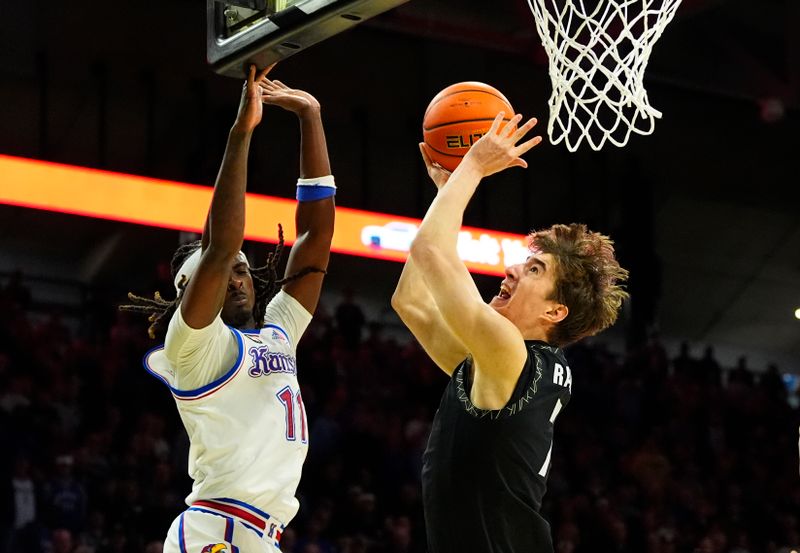 Jan 20, 2026; Boulder, Colorado, USA; Kansas Jayhawks guard Jamari McDowell (11) defends the shot by Kansas Jayhawks guard Kohl Rosario (7) in the second half at the CU Events Center. Mandatory Credit: Ron Chenoy-Imagn Images