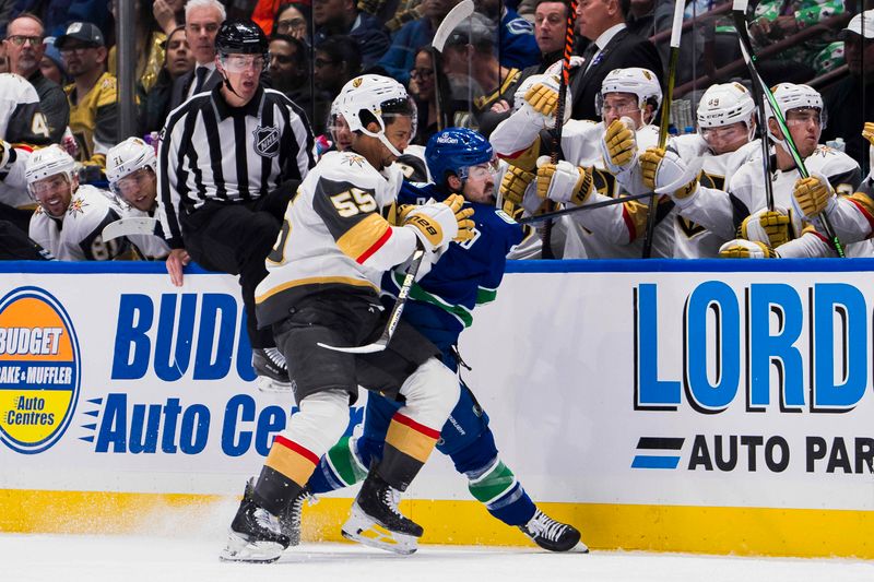 Nov 30, 2023; Vancouver, British Columbia, CAN; Vegas Golden Knights forward Keegan Kolesar (55) checks Vancouver Canucks forward Conor Garland (8) in the second period at Rogers Arena. Mandatory Credit: Bob Frid-USA TODAY Sports