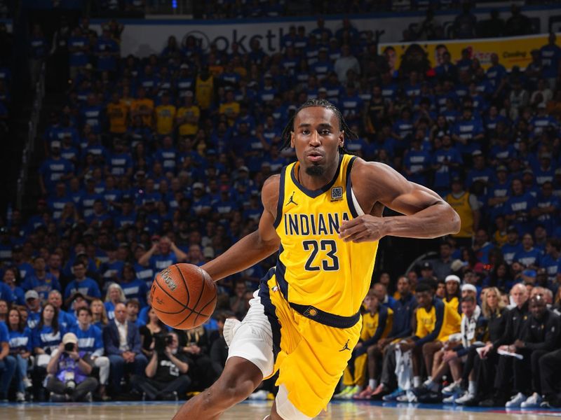 OKLAHOMA CITY, OK - JUNE 8: Aaron Nesmith #23 of the Indiana Pacers dribbles the ball during the game against the Oklahoma City Thunder  during Game Two of the 2025 NBA Finals on June 8, 2025 at Paycom Center in Oklahoma City, Oklahoma. NOTE TO USER: User expressly acknowledges and agrees that, by downloading and or using this photograph, User is consenting to the terms and conditions of the Getty Images License Agreement. Mandatory Copyright Notice: Copyright 2025 NBAE (Photo by Jesse D. Garrabrant/NBAE via Getty Images)