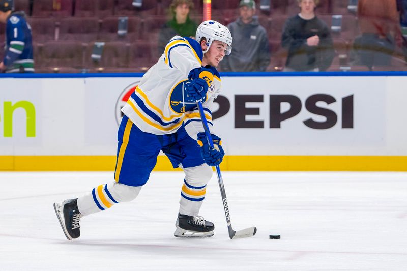 Mar 19, 2024; Vancouver, British Columbia, CAN; Buffalo Sabres forward Zach Benson (9) shoots during warm up prior to a game against the Vancouver Canucks at Rogers Arena. Mandatory Credit: Bob Frid-USA TODAY Sports