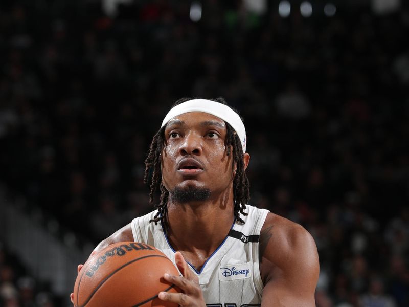 MILWAUKEE, WI - JANUARY 15:  Wendell Carter Jr. #34 of the Orlando Magic shoots a free throw during the game against the Milwaukee Bucks on January 15, 2025 at Fiserv Forum Center in Milwaukee, Wisconsin. NOTE TO USER: User expressly acknowledges and agrees that, by downloading and or using this Photograph, user is consenting to the terms and conditions of the Getty Images License Agreement. Mandatory Copyright Notice: Copyright 2025 NBAE (Photo by Gary Dineen/NBAE via Getty Images).