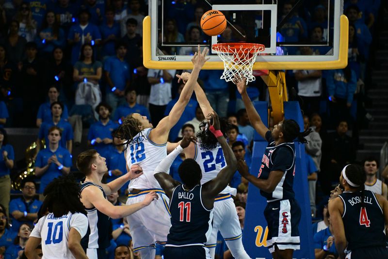 Mar 4, 2023; Los Angeles, California, USA;  UCLA Bruins forward Mac Etienne (12) shoots for the basket during the first half against Arizona Wildcats at Pauley Pavilion presented by Wescom. Mandatory Credit: Richard Mackson-USA TODAY Sports