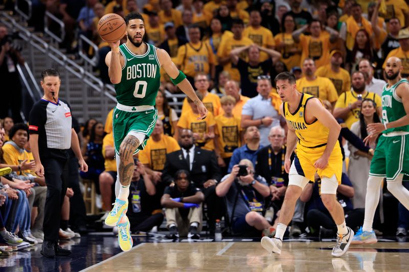 INDIANAPOLIS, INDIANA - MAY 27: Jayson Tatum #0 of the Boston Celtics looks to pass after a rebound during the fourth quarter in Game Four of the Eastern Conference Finals at Gainbridge Fieldhouse on May 27, 2024 in Indianapolis, Indiana. NOTE TO USER: User expressly acknowledges and agrees that, by downloading and or using this photograph, User is consenting to the terms and conditions of the Getty Images License Agreement. (Photo by Justin Casterline/Getty Images)