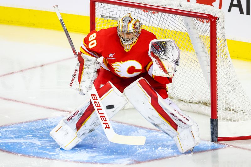 Sep 23, 2024; Calgary, Alberta, CAN; Calgary Flames goaltender Dan Vladar (80) guards his net during the warmup period against the Edmonton Oilers at Scotiabank Saddledome. Mandatory Credit: Sergei Belski-Imagn Images