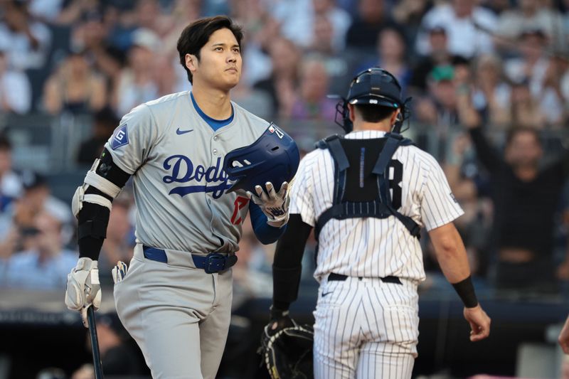 Jun 8, 2024; Bronx, New York, USA; Los Angeles Dodgers two-way player Shohei Ohtani (17) reacts after striking out during the first inning against the New York Yankees at Yankee Stadium. Mandatory Credit: Vincent Carchietta-USA TODAY Sports