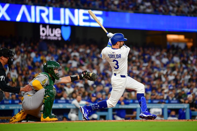 May 13, 2025; Los Angeles, California, USA; Los Angeles Dodgers outfielder Chris Taylor (3) hits a double in the third inning against the Oakland Athletics at Dodger Stadium. Mandatory Credit: Gary A. Vasquez-Imagn Images