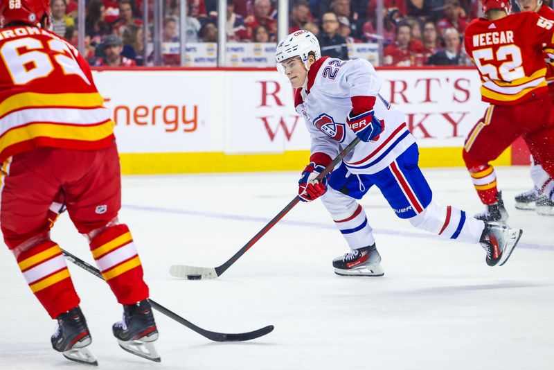 Mar 16, 2024; Calgary, Alberta, CAN; Montreal Canadiens right wing Cole Caufield (22) skates with the puck against the Calgary Flames during the first period at Scotiabank Saddledome. Mandatory Credit: Sergei Belski-USA TODAY Sports