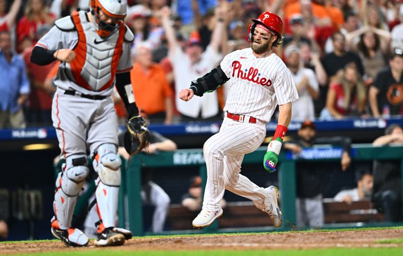 Jul 25, 2023; Philadelphia, Pennsylvania, USA; Philadelphia Phillies first baseman Bryce Harper (3) slides home to score against the Baltimore Orioles in the ninth inning at Citizens Bank Park. Mandatory Credit: Kyle Ross-USA TODAY Sports