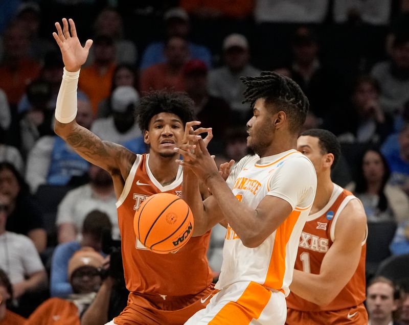 March 23, 2024, Charlotte, NC, USA; Tennessee Volunteers guard Josiah-Jordan James (30) battles for the ball with Texas Longhorns forward Dillon Mitchell (23) in the second round of the 2024 NCAA Tournament at the Spectrum Center. Mandatory Credit: Bob Donnan-USA TODAY Sports