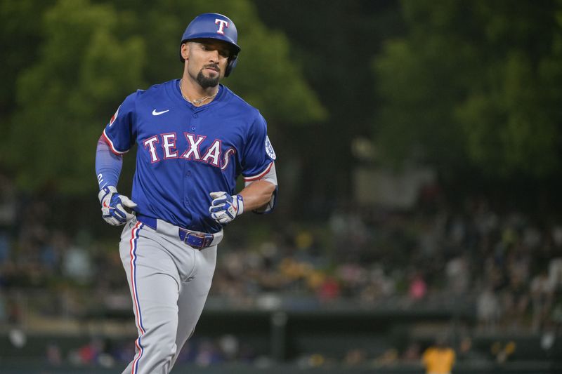 Apr 22, 2025; West Sacramento, California, USA; Texas Rangers second baseman Marcus Semien (2) hits a home run against the Athletics during the fifth inning at Sutter Health Park. Mandatory Credit: Ed Szczepanski-Imagn Images