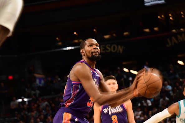 PHOENIX, AZ - DECEMBER 29: Kevin Durant #35 of the Phoenix Suns shoots a free throw during the game against the Charlotte Hornets on December 29, 2023 at Footprint Center in Phoenix, Arizona. NOTE TO USER: User expressly acknowledges and agrees that, by downloading and or using this photograph, user is consenting to the terms and conditions of the Getty Images License Agreement. Mandatory Copyright Notice: Copyright 2023 NBAE (Photo by Kate Frese/NBAE via Getty Images)