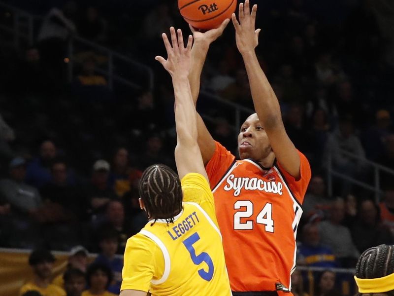 Jan 16, 2024; Pittsburgh, Pennsylvania, USA; Syracuse Orange guard Quadir Copeland (24) shoots against Pittsburgh Panthers guard Ishmael Leggett (5) during the first half at the Petersen Events Center. Mandatory Credit: Charles LeClaire-USA TODAY Sports