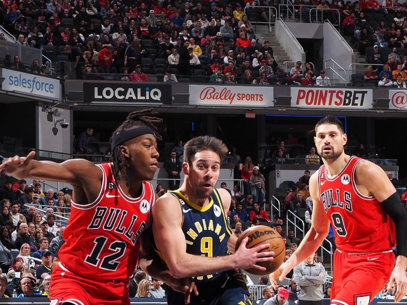 INDIANAPOLIS, IN - JANUARY 24: T.J. McConnell #9 of the Indiana Pacers drives to the basket during the game against the Chicago Bulls on January 24, 2023 at Gainbridge Fieldhouse in Indianapolis, Indiana. NOTE TO USER: User expressly acknowledges and agrees that, by downloading and or using this Photograph, user is consenting to the terms and conditions of the Getty Images License Agreement. Mandatory Copyright Notice: Copyright 2022 NBAE (Photo by Ron Hoskins/NBAE via Getty Images)