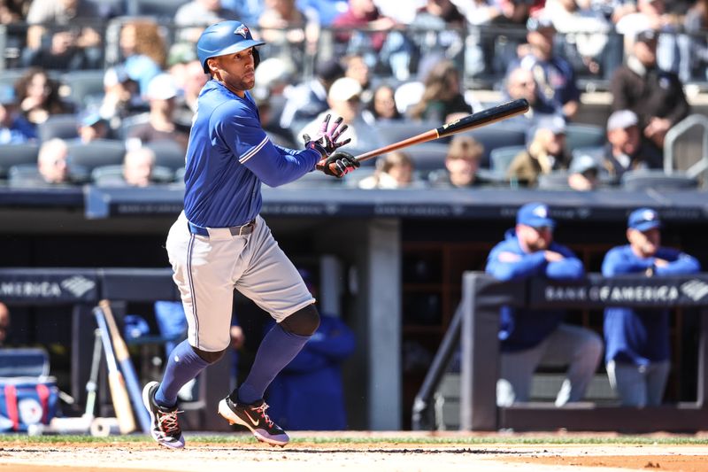 Apr 7, 2024; Bronx, New York, USA; Toronto Blue Jays designated hitter George Springer (4) hits a single in the third inning against the New York Yankees at Yankee Stadium. Mandatory Credit: Wendell Cruz-USA TODAY Sports