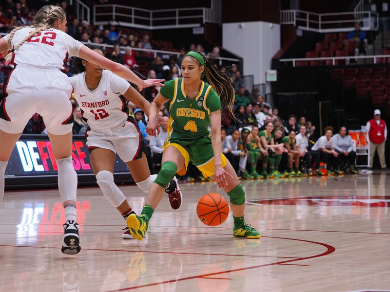 Jan 29, 2023; Stanford, California, USA; Oregon Ducks guard Endiya Rogers (4) controls the ball against Stanford Cardinal guard Indya Nivar (12) during the first quarter at Maples Pavilion. Mandatory Credit: Kelley L Cox-USA TODAY Sports