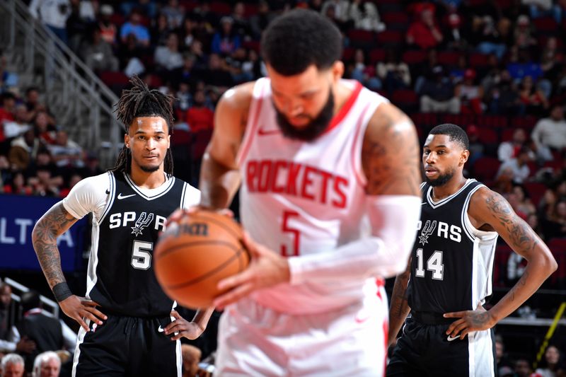 HOUSTON, TX - OCTOBER 17: Stephon Castle #5 and Blake Wesley #14 of the San Antonio Spurs look on during the game against the Houston Rockets on October 17, 2024 at the Toyota Center in Houston, Texas. NOTE TO USER: User expressly acknowledges and agrees that, by downloading and or using this photograph, User is consenting to the terms and conditions of the Getty Images License Agreement. Mandatory Copyright Notice: Copyright 2024 NBAE (Photo by Logan Riely/NBAE via Getty Images)