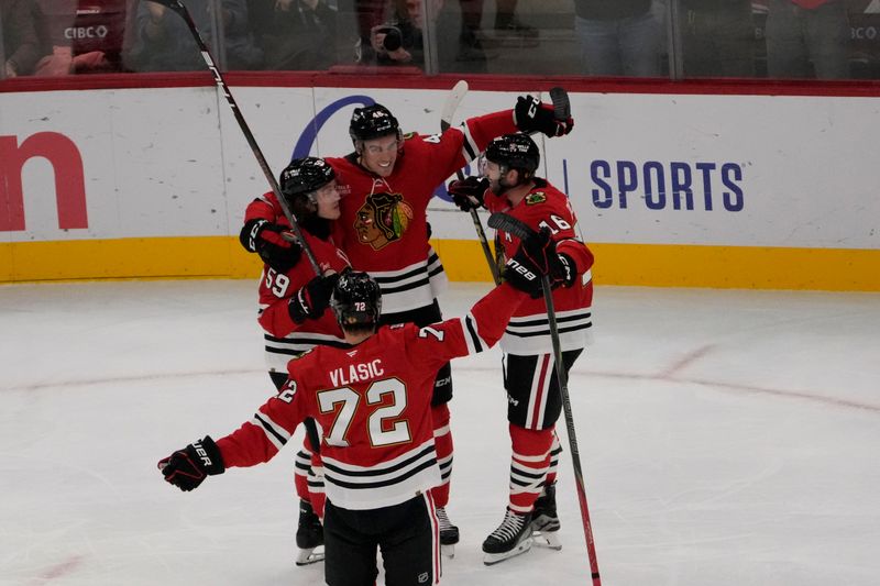 Oct 28, 2025; Chicago, Illinois, USA; Chicago Blackhawks defenseman Louis Crevier (46) celebrates his goal against the Ottawa Senators with his teammates during the first period at United Center. Mandatory Credit: David Banks-Imagn Images