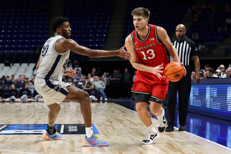 Feb 18, 2026; University Park, Pennsylvania, USA; Rutgers Scarlet Knights guard Harun Zrno (13) dribbles the ball around Penn State Nittany Lions forward Josh Reed (10) during the second half at Bryce Jordan Center. Mandatory Credit: Matthew O'Haren-Imagn Images