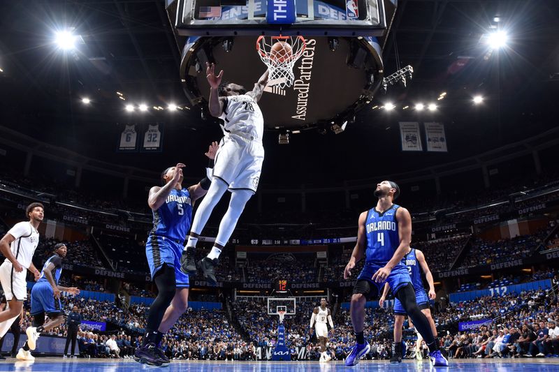 ORLANDO, FL - OCTOBER 25: Dorian Finney-Smith #28 of the Brooklyn Nets drives to the basket during the game against the Orlando Magic on October 25, 2024 at Kia Center in Orlando, Florida. NOTE TO USER: User expressly acknowledges and agrees that, by downloading and or using this photograph, User is consenting to the terms and conditions of the Getty Images License Agreement. Mandatory Copyright Notice: Copyright 2024 NBAE (Photo by Fernando Medina/NBAE via Getty Images)
