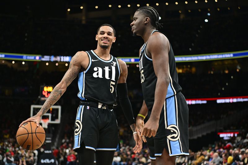 ATLANTA, GA - JANUARY 30: Dejounte Murray #5 and Clint Capela #15 of the Atlanta Hawks look on during the game against the Los Angeles Lakers on January 30, 2024 at State Farm Arena in Atlanta, Georgia.  NOTE TO USER: User expressly acknowledges and agrees that, by downloading and/or using this Photograph, user is consenting to the terms and conditions of the Getty Images License Agreement. Mandatory Copyright Notice: Copyright 2024 NBAE (Photo by Adam Hagy/NBAE via Getty Images)