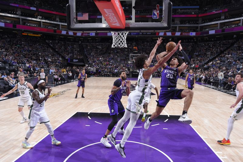 SACRAMENTO, CA - MARCH 12: Colby Jones #20 of the Sacramento Kings drives to the basket during the game against the Milwaukee Bucks on March 12, 2024 at Golden 1 Center in Sacramento, California. NOTE TO USER: User expressly acknowledges and agrees that, by downloading and or using this Photograph, user is consenting to the terms and conditions of the Getty Images License Agreement. Mandatory Copyright Notice: Copyright 2024 NBAE (Photo by Rocky Widner/NBAE via Getty Images)