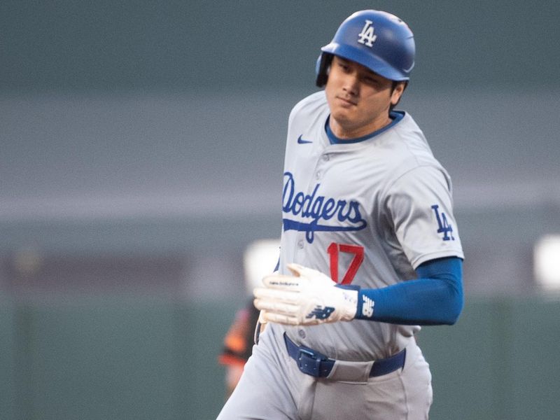 Jun 29, 2024; San Francisco, California, USA; Los Angeles Dodgers two-way player Shohei Ohtani (17) rounds third base during the tenth inning against the San Francisco Giants at Oracle Park. Mandatory Credit: Ed Szczepanski-USA TODAY Sports