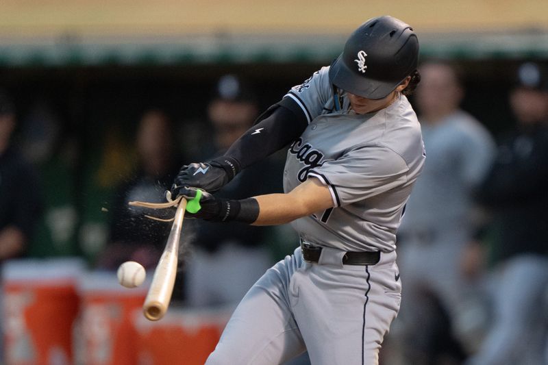 Aug 6, 2024; Oakland, California, USA;  Chicago White Sox shortstop Brooks Baldwin (27) breaks the bat during the sixth inning against the Oakland Athletics at Oakland-Alameda County Coliseum. Mandatory Credit: Stan Szeto-USA TODAY Sports