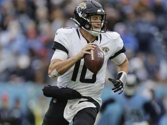 Jacksonville Jaguars quarterback Mac Jones (10) runs with the ball during the second half of an NFL football game against the Tennessee Titans, Sunday, Dec. 8, 2024, in Nashville, Tenn. (AP Photo/Stew Milne)