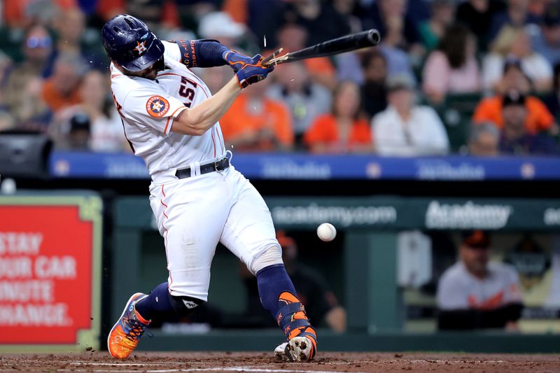 Sep 20, 2023; Houston, Texas, USA; Houston Astros left fielder Chas McCormick (20) breaks his bat while hitting a single against the Baltimore Orioles during the third inning at Minute Maid Park. Mandatory Credit: Erik Williams-USA TODAY Sports
