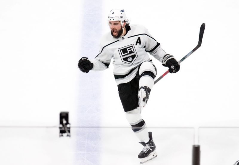 Oct 27, 2023; Tempe, Arizona, USA; Los Angeles Kings defenseman Drew Doughty (8) celebrates a goal against the Arizona Coyotes during the third period at Mullett Arena. Mandatory Credit: Joe Camporeale-USA TODAY Sports