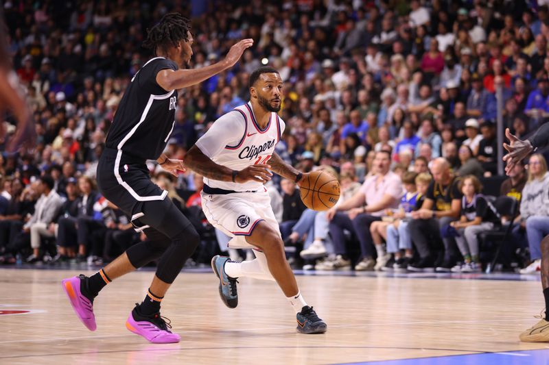 OCEANSIDE, CALIFORNIA - OCTOBER 08: Norman Powell #24 of the Los Angeles Clippers moves the ball up the court in the second quarter of the preseason game against the Brooklyn Nets at Frontwave Arena on October 08, 2024 in Oceanside, California. NOTE TO USER: User expressly acknowledges and agrees that, by downloading and or using this photograph, User is consenting to the terms and conditions of the Getty Images License Agreement. (Photo by Joe Scarnici/Getty Images)