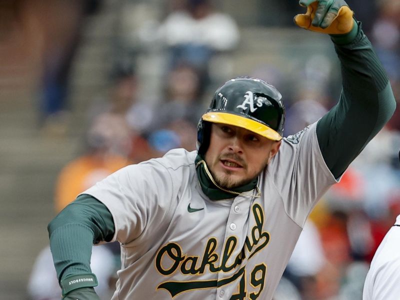 Apr 5, 2024; Detroit, Michigan, USA;  Oakland Athletics first baseman Ryan Noda (49) celebrates after hitting a double in the seventh inning against the Detroit Tigers at Comerica Park. Mandatory Credit: Rick Osentoski-USA TODAY Sports