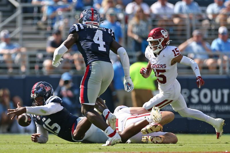 Oct 26, 2024; Oxford, Mississippi, USA; Mississippi Rebels defensive end Jared Ivey (15) recovers a fumble during the first half against the Oklahoma Sooners at Vaught-Hemingway Stadium. Mandatory Credit: Petre Thomas-Imagn Images