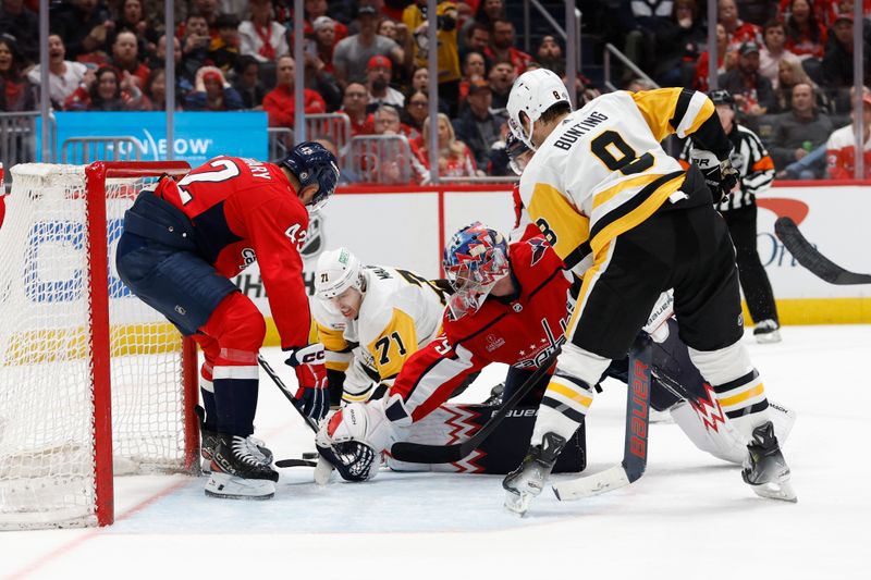 Apr 4, 2024; Washington, District of Columbia, USA; Pittsburgh Penguins center Evgeni Malkin (71) attempts to shoot the puck on Washington Capitals goaltender Charlie Lindgren (79) as Capitals defenseman Martin Fehervary (42) defends in the second period at Capital One Arena. Mandatory Credit: Geoff Burke-USA TODAY Sports