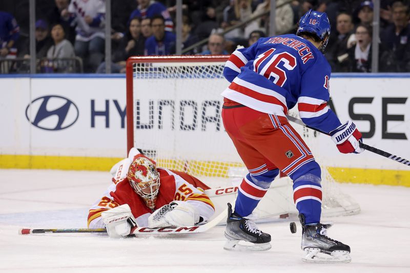 Feb 12, 2024; New York, New York, USA; Calgary Flames goaltender Jacob Markstrom (25) makes a save against New York Rangers center Vincent Trocheck (16) during the first period at Madison Square Garden. Mandatory Credit: Brad Penner-USA TODAY Sports