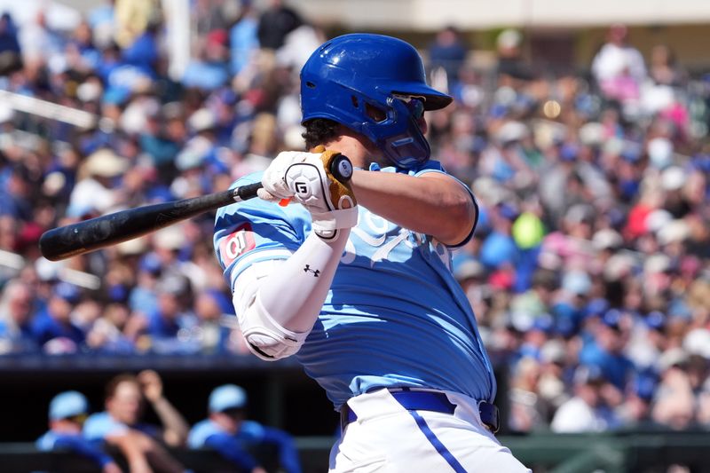 Mar 13, 2024; Surprise, Arizona, USA; Kansas City Royals first baseman Vinnie Pasquantino (9) bats against the Los Angeles Angels during the third inning at Surprise Stadium. Mandatory Credit: Joe Camporeale-USA TODAY Sports