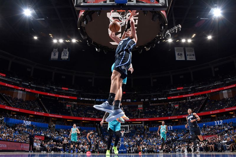 ORLANDO, FL - MARCH 19: Franz Wagner #22 of the Orlando Magic dunks the ball during the game against the Charlotte Hornets on March 19, 2024 at the Kia Center in Orlando, Florida. NOTE TO USER: User expressly acknowledges and agrees that, by downloading and or using this photograph, User is consenting to the terms and conditions of the Getty Images License Agreement. Mandatory Copyright Notice: Copyright 2024 NBAE (Photo by Fernando Medina/NBAE via Getty Images)