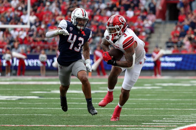 Nov 18, 2023; Tucson, Arizona, USA; Utah Utes running back Ja'Quinden Jackson (3) makes a catch against Arizona Wildcats safety Dalton Johnson (43) during the first half at Arizona Stadium. Mandatory Credit: Zachary BonDurant-USA TODAY Sports