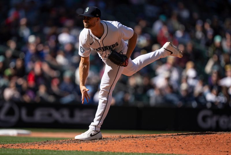 Apr 17, 2024; Seattle, Washington, USA; Seattle Mariners reliever Austin Voth (30) delivers a pitch during the ninth inning against the Cincinnati Reds at T-Mobile Park. Mandatory Credit: Stephen Brashear-USA TODAY Sports