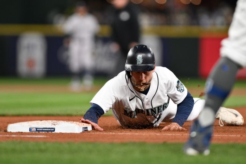 Apr 15, 2023; Seattle, Washington, USA; Seattle Mariners left fielder Jarred Kelenic (10) returns to first base during the sixth inning against the Colorado Rockies at T-Mobile Park. Mandatory Credit: Steven Bisig-USA TODAY Sports