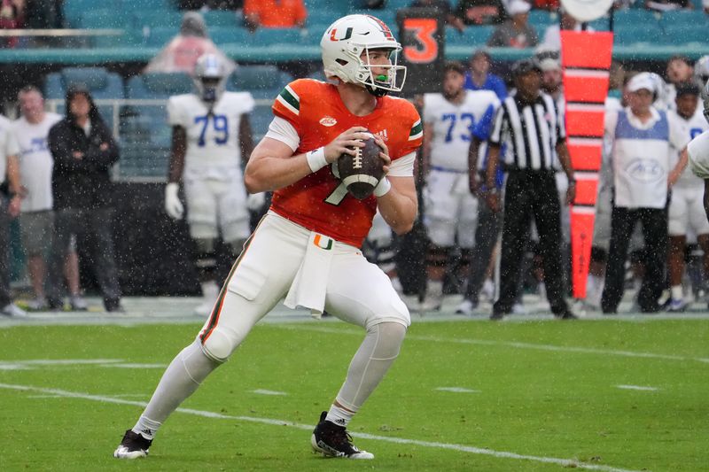 Sep 24, 2022; Miami Gardens, Florida, USA; Miami Hurricanes quarterback Tyler Van Dyke (9) drops back with the ball before attempting a pass against the Middle Tennessee Blue Raiders during the first half at Hard Rock Stadium. Mandatory Credit: Jasen Vinlove-USA TODAY Sports