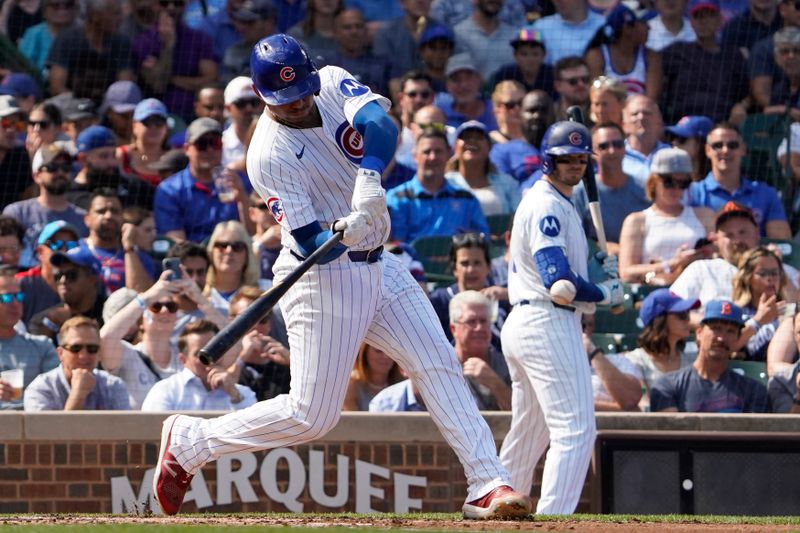 Sep 20, 2024; Chicago, Illinois, USA; Chicago Cubs catcher Christian Bethancourt (60) hits a single against the Washington Nationals during the third inning at Wrigley Field. Mandatory Credit: David Banks-Imagn Images