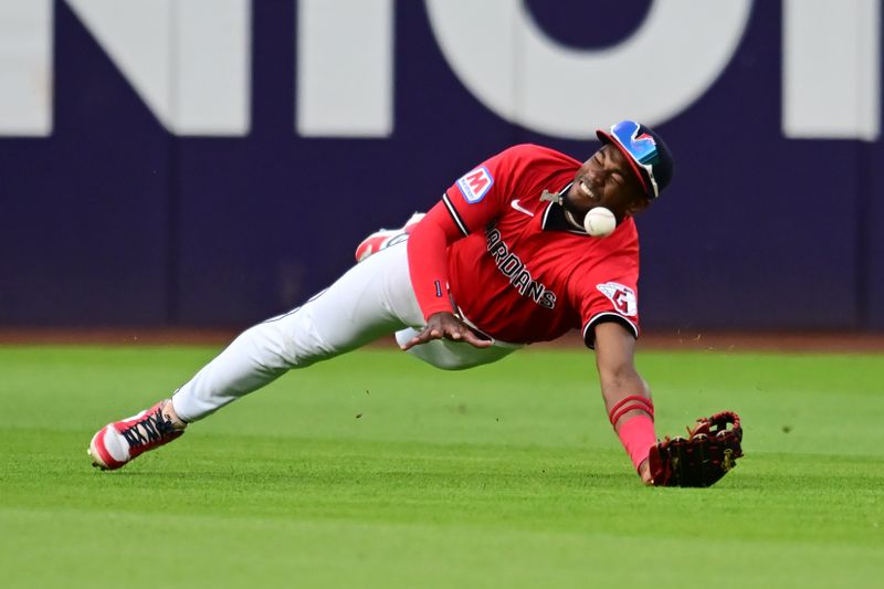 May 10, 2025; Cleveland, Ohio, USA; Cleveland Guardians center fielder Angel Martinez (1) can not catch the ball hit by Philadelphia Phillies catcher J.T. Realmuto (not pictured) during the seventh inning at Progressive Field. Mandatory Credit: Ken Blaze-Imagn Images