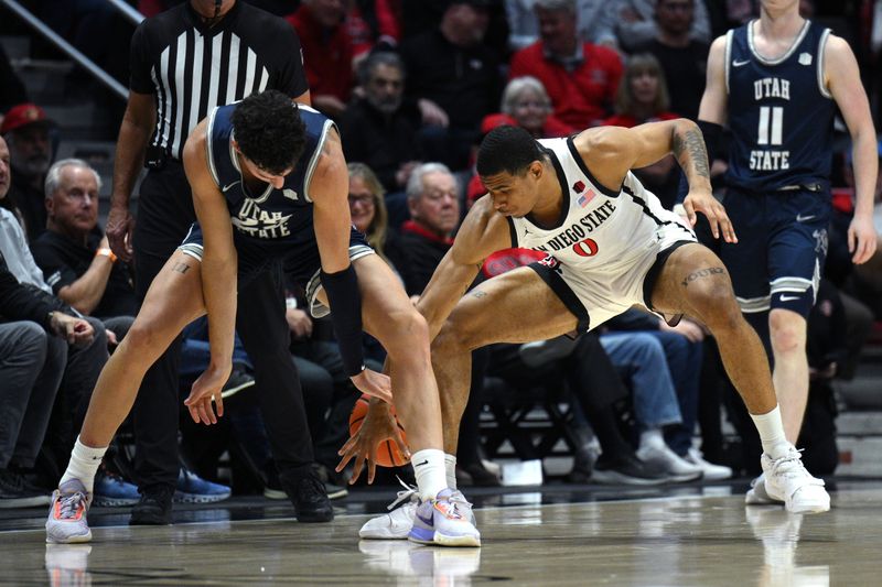 Jan 25, 2023; San Diego, California, USA; Utah State Aggies forward Taylor Funk (23) and San Diego State Aztecs forward Keshad Johnson (0) battle for a loose ball during the first half at Viejas Arena. Mandatory Credit: Orlando Ramirez-USA TODAY Sports